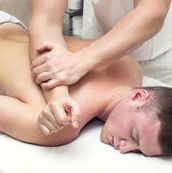 stock-photo-man-doing-sports-massage-at-the-massage-parlor-344131154
